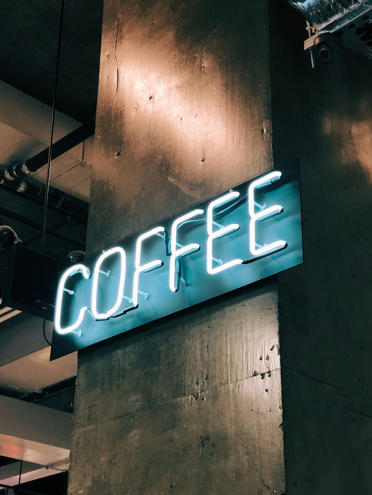 coffee sign on pillar with neon light